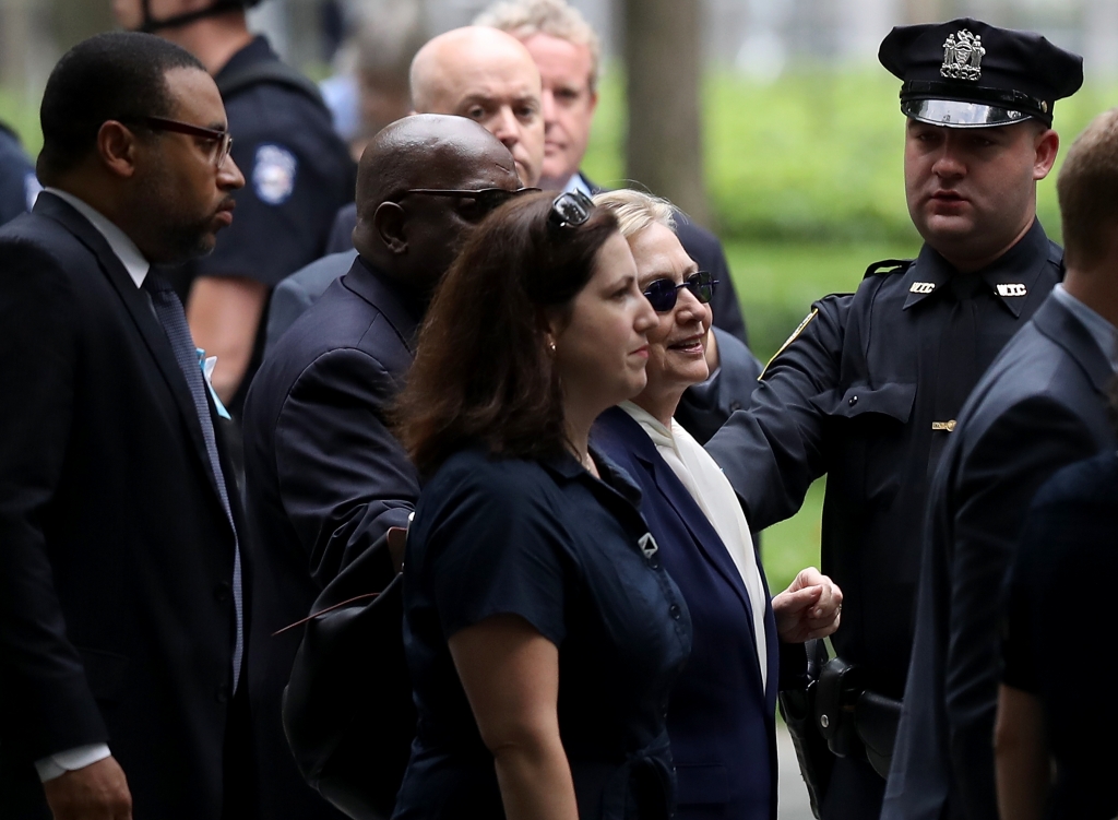 Democratic presidental nominee former Secretary of State Hillary Clinton arrives with an unidentified woman at the September 11 Commemoration Ceremony at the National September 11 Memorial & Museum