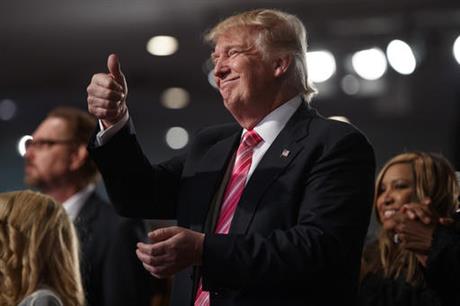 Republican presidential candidate Donald Trump gives a thumbs up during a church service at Great Faith Ministries Saturday Sept. 3 2016 in Detroit