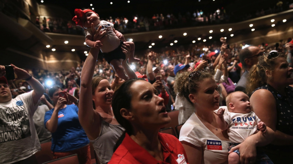 Women hold up their babies for Republican Presidential nominee Donald Trump as he speaks at a campaign rally on August 1 in Mechanicsburg Pennsylvania