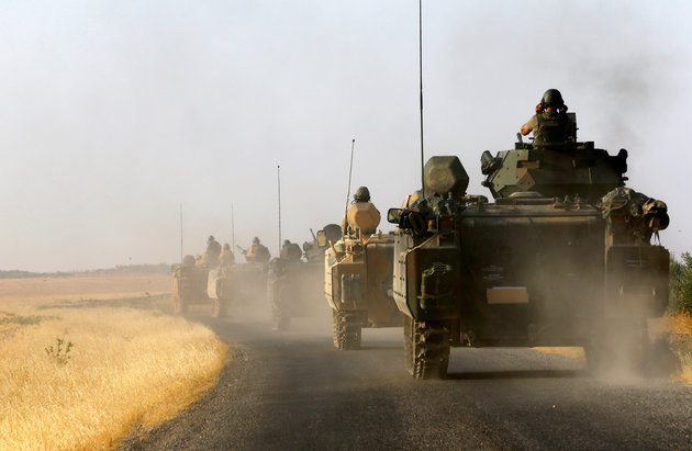 Turkish army building concrete wall along Syrian border