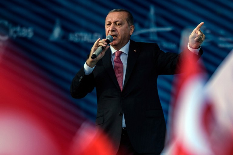 Turkish President Recep Tayyip Erdogan delivers a speech during the inauguration of the Yavuz Sultan Selim bridge in Istanbul