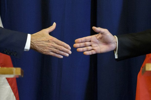 US Secretary of State John Kerry and Russian Foreign Minister Sergei Lavrov shake hands at the end of a press conference closing meetings to discuss the Syrian crisis