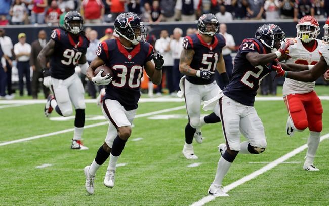 Houston Texans cornerback Kevin Johnson runs with the ball after an interception against the Kansas City Chiefs during the first half of an NFL football game Sunday Sept. 18 2016 in Houston