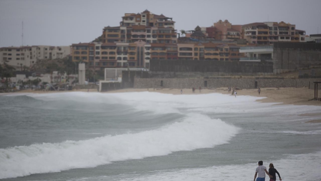 Two people have died after a boat capsized in strong waves caused by Hurricane Newton in Mexico