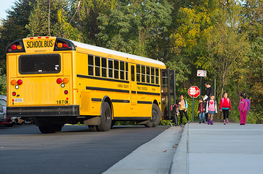 VIDEO: Two AISD students hit by trucks after getting off bus