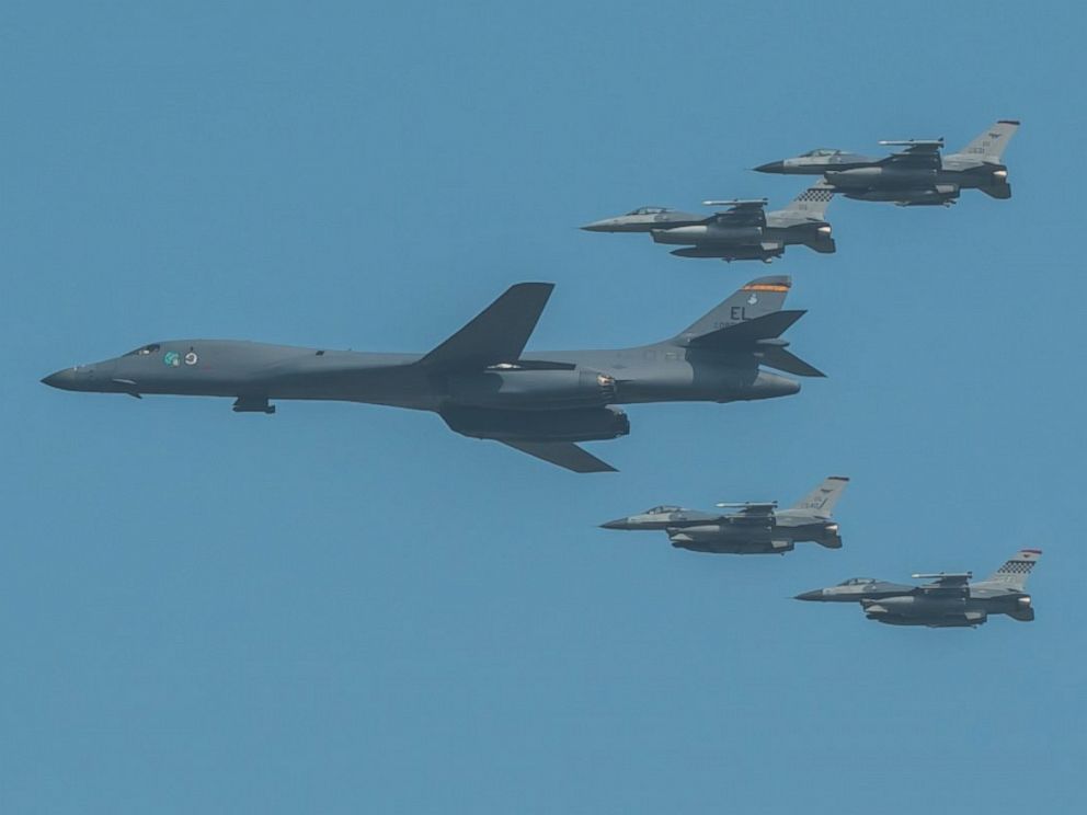 Force B-1B Lancer escorted by U.S. Air Force F-16 Fighting Falcons performs a flyover over Osan Air Base in South Korea Sept. 13 2016