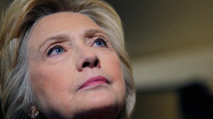 U.S. Democratic presidential nominee Hillary Clinton answers a question from a reporter on her campaign plane enroute to Tampa