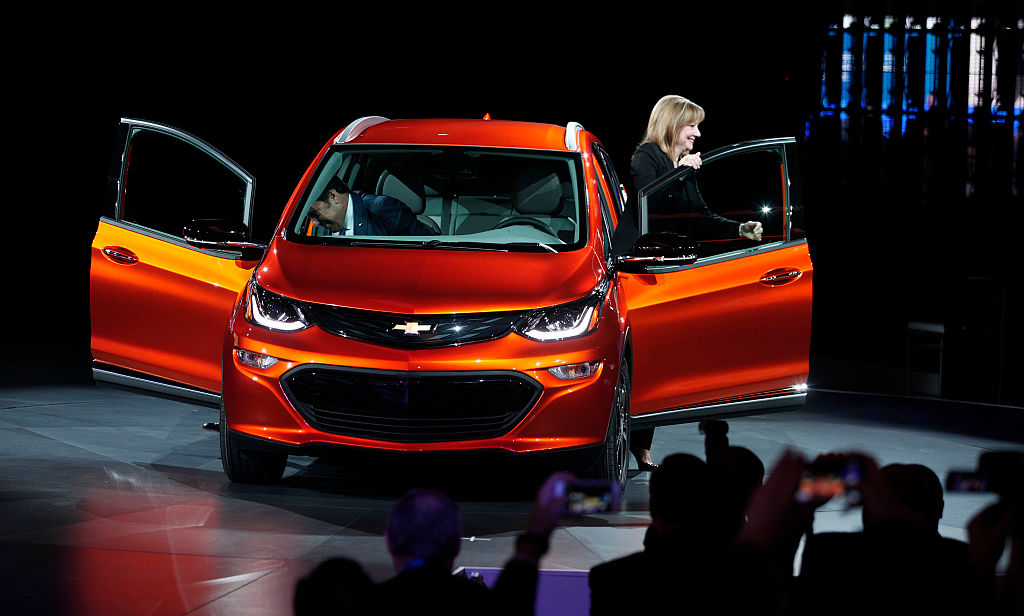 Mary Barra Chairman and CEO of General Motors and Mark Reuss Executive Vice President of GM Global Product Development reveal the Chevrolet Bolt EV to the news media at the 2016 North American International Auto Show January 11th 2016 in Detroit Mic