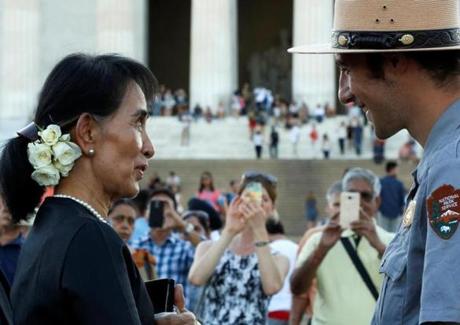 Myanmar's State Counsellor Aung San Suu Kyi was guided by US National Park Service ranger Heath Mitchell as she visited the Lincoln Memorial in Washington Wednesday