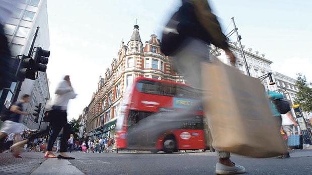 Shoppers crossing the road in Oxford Street London