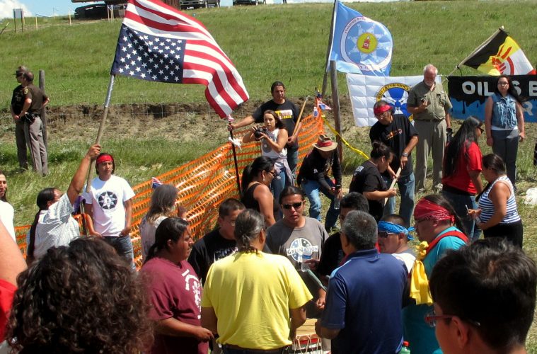 Native Americans protest the Dakota Access oil pipeline on Friday Aug. 12 2016 near the Standing Rock Sioux reservation in southern North Dakota. The Standing Rock Sioux Tribe went to court to try to block a $3.8 billion pipeline that's going in