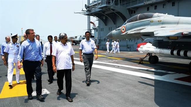 US Defense Secretary Ash Carter front left tours an Indian aircraft carrier at Karwar Naval Base in Karnataka during his visit