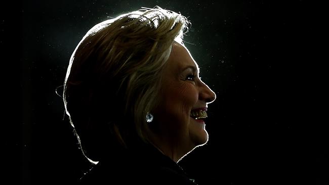 US Democratic presidential nominee Hillary Clinton waves to the press as she leaves her daughter's house in New York