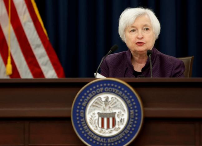 Fed keeps key rate unchanged but hints of coming hike