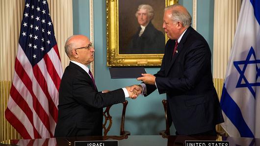 Jacob Nagel, Israel's acting National Security Advisor and Tom Shannon, U.S. Undersecretary of State exchange the agreements during a signing ceremony for the new 10-year defense assistance pact between the US and Israel at the Department