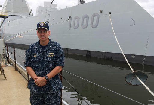 Capt. James Kirk skipper of the future USS Zumwalt stands in front of the destroyer at Bath Iron Works on Tuesday Sept. 6 2016 in Bath Maine. The ship is due to depart the shipyard on Wednesday to be commissioned in Baltimore