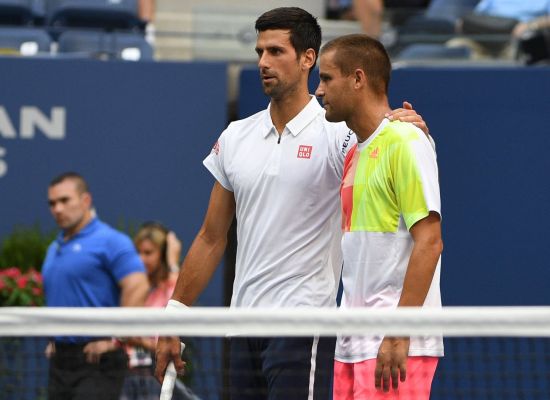 Novak Djokovic of Serbia is seen with Mikhail