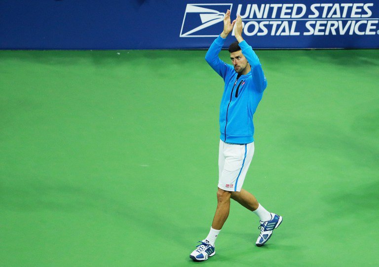 Novak Djokovic of Serbia celebrates defeating Jo Wilfried Tsonga of France during their Men's Singles Quarterfinals match on Day Nine of the 2016 US Open at the USTA Billie Jean King National Tennis Center