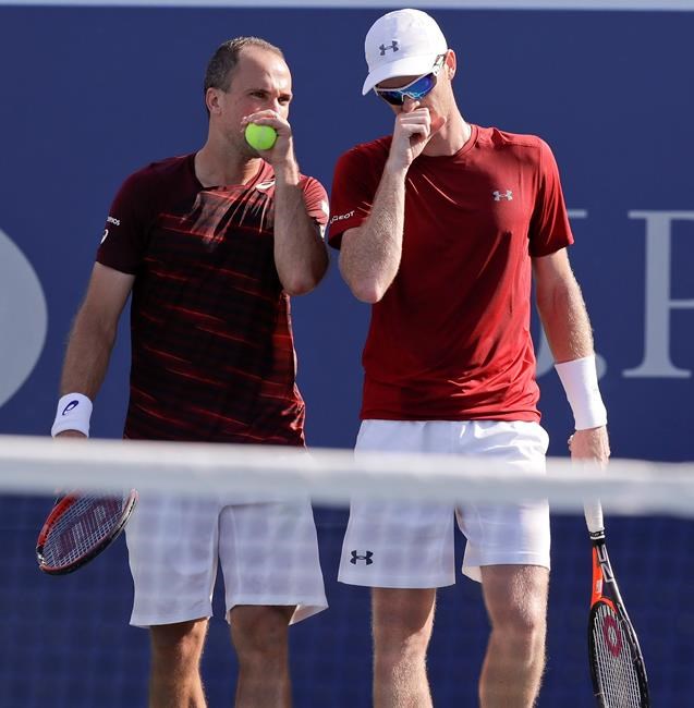 Bruno Soares of Brazil left talks with doubles partner Jamie Murray of the United Kingdom during the men's doubles semifinals against Pierre Hugues Herbert of France and Nicolas Mahut of France at the U.S. Open tennis tournament Thursday S