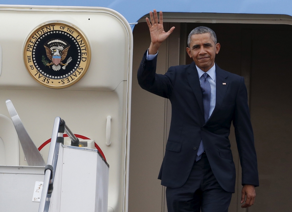 US President Barack Obama disembarks from Air Force One.   Reuters