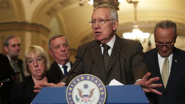 US Senate Minority Leader Senator Harry Reid speaks during a news briefing