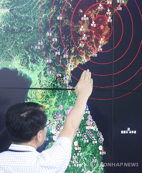 An official points to North Korea's northeastern county of Kilju where the communist country conducted a nuclear test at the Korea Meteorological Agency in Seoul on Sept. 9 2016. The test the fifth of its kind caused a 5 magnitude tremor. (Yonha