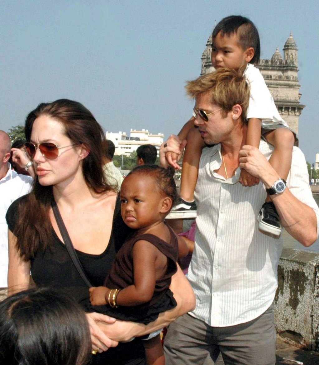 US actress Angelina Jolie with daughter Zahara and US actor Brad Pitt with son Maddox walking near the Gateway of India in Mumbai India