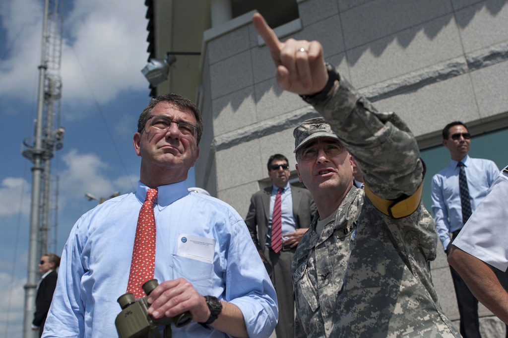 Defense Secretary Ash Carter speaking to U.S. Navy Petty Officer 1st Class Chad J. Mc Neeley in 2012