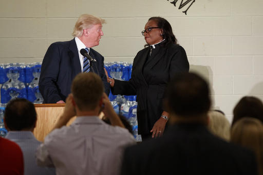 Rev. Faith Green Timmons interrupts Republican presidential candidate Donald Trump as he spoke during a visit to Bethel United Methodist Church Sept. 14 2016 in Flint Mich