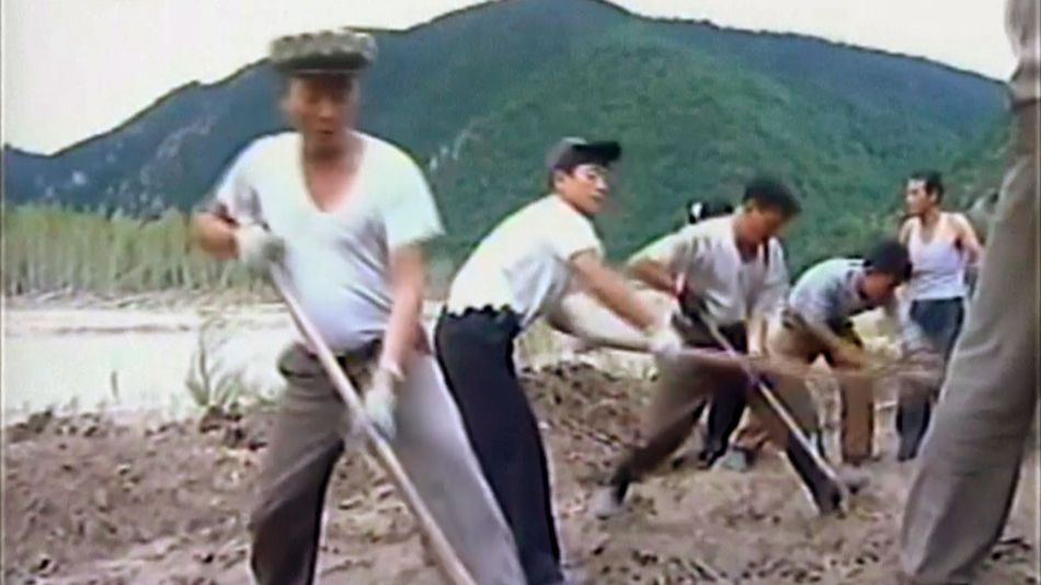 In this undated image from video distributed on Sept. 12 by North Korean broadcaster KRT North Korean workers build levees along a river bank