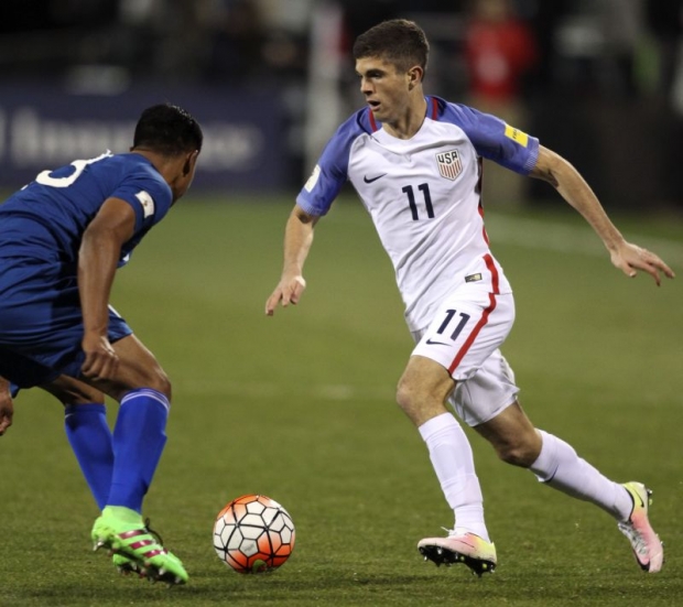 USA midfielder Christian Pulisic and Guatemala defender Carlos Castrillo play during the 2018 Fifa World Cup qualifying semifinal round match Columbus Ohio