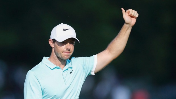 Rory Mc Ilroy reacts as he approaches the sixteenth green in regulation play during the final round