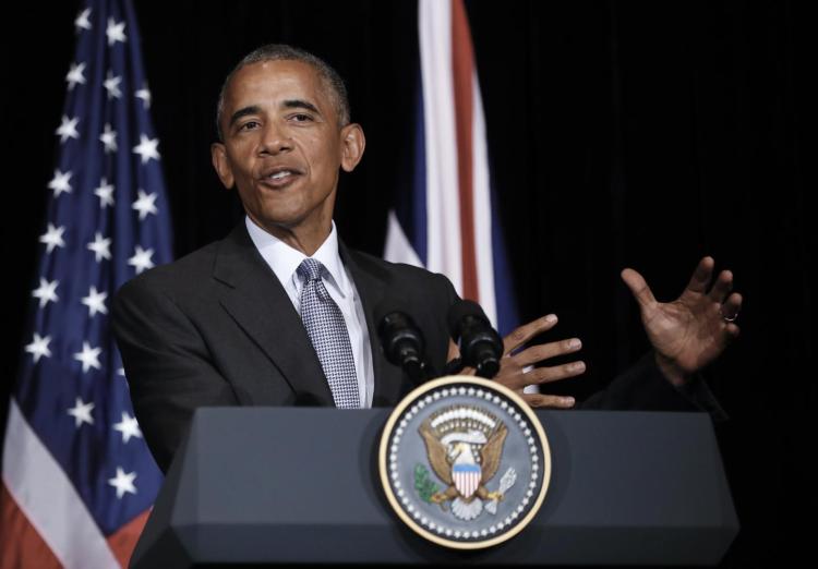 U.S. President Barack Obama speaks during a news conference with British Prime Minister Theresa May after their bilateral meeting in Hangzhou in eastern China's Zhejiang province Sunday Sept. 4 2016 alongside the G20