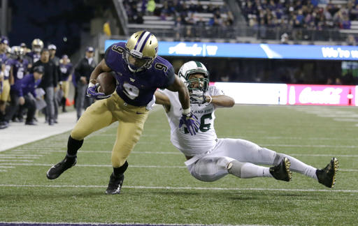 Washington running back Myles Gaskin runs to the end zone for a touchdown evading Portland State defensive end Sam Bodine in the second half of an NCAA college football game Saturday Sept. 17 2016 in Seattle. Washington