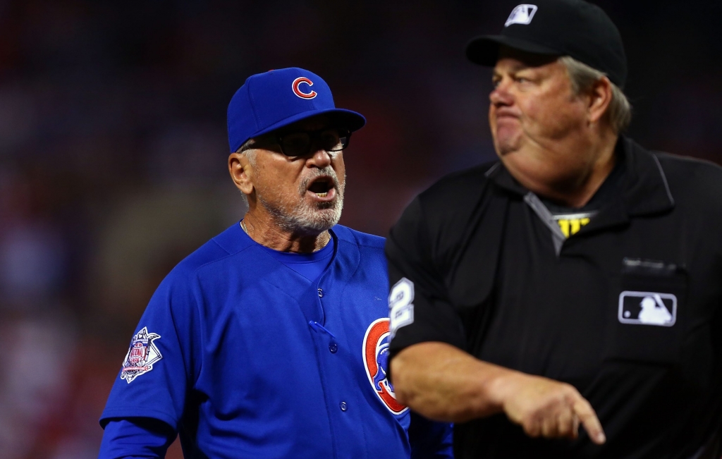 Umpire Joe West right ejects Cubs manager Joe Maddon