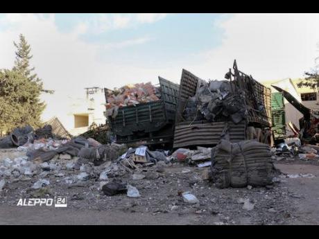 Uncredited     Damaged trucks carrying aid in Aleppo Syria after a UN humanitarian aid convoy in Syria was hit by airstrikes Monday