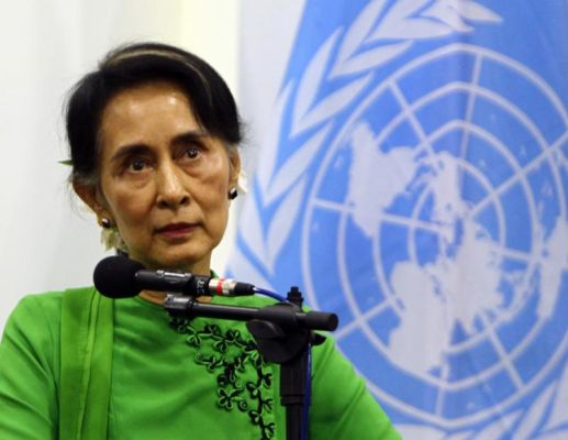 Myanmar Foreign Minister Aung San Suu Kyi listens