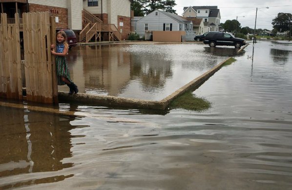 VICKI CRONIS-NOHE						Credit AP  The Virginian Pilot				Chloe Riffle 7 is surrounded by water Sunday in the Ocean View section of Norfolk Va