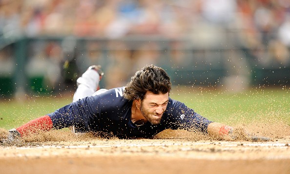 WASHINGTON DC- SEPTEMBER 06 Dansby Swanson #2 of the Atlanta Braves slides into home plate with an inside-the-park home run for his first career home run in the second inning against the Washington Nationals at Nationals Park