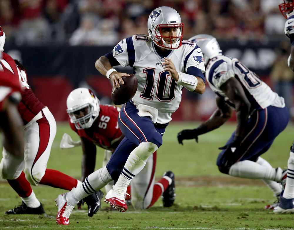 New England Patriots quarterback Jimmy Garoppolo scrambles against the Arizona Cardinals during the second half of an NFL football game Sunday Sept. 11 2016 in Glendale Ariz