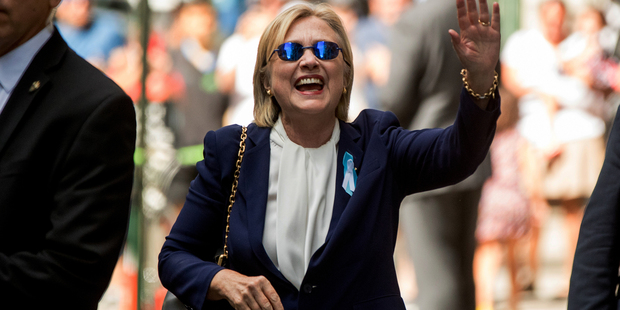 Loading Democratic presidential candidate Hillary Clinton waves hours after her health scare