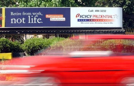 VEHICLE PASSES A LIFE INSURANCE BILL BOARD IN BOMBAY