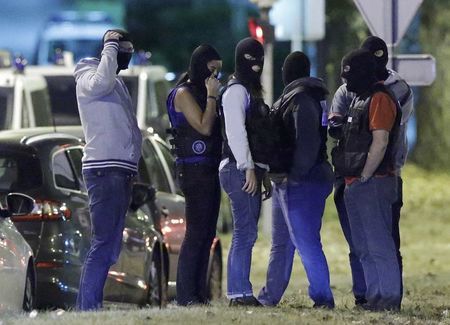 French policemen take part in a police raid in Boussy-Saint-Antoine near Paris