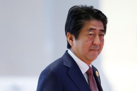 Japan's Prime Minister Shinzo Abe arrives at the ASEAN Summit in Vientiane