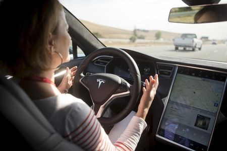 New Autopilot features are demonstrated in a Tesla Model S during a Tesla event in Palo Alto California