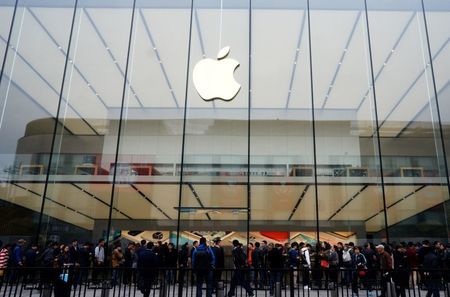 People line up outside an Apple store in Hangzhou