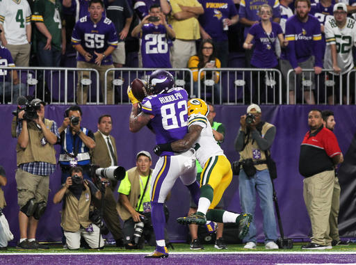 Minnesota Vikings tight end Kyle Rudolph catches an 8-yard touchdown pass over Green Bay Packers strong safety Morgan Burnett during the first half of an NFL football game Sunday Sept. 18 2016 in Minneapolis