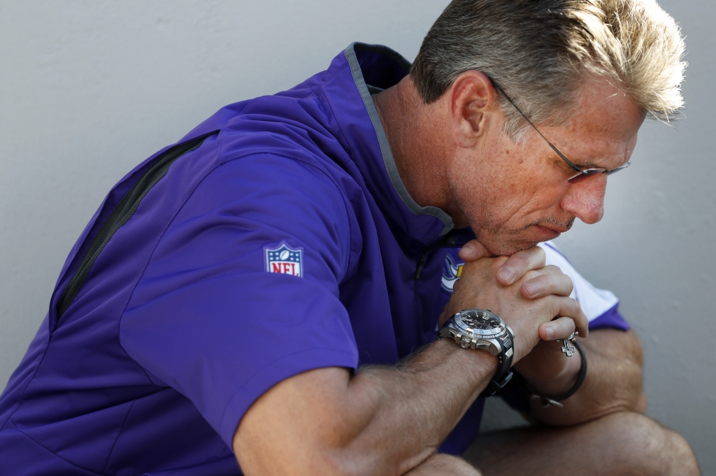 Minnesota Vikings general manager Rick Spielman listens to head coach Mike Zimmer speak during a news conference about the injury to quarterback Teddy Bridgewater Tuesday Aug. 30 2016 in Eden Prairie Minn. ORG XMI