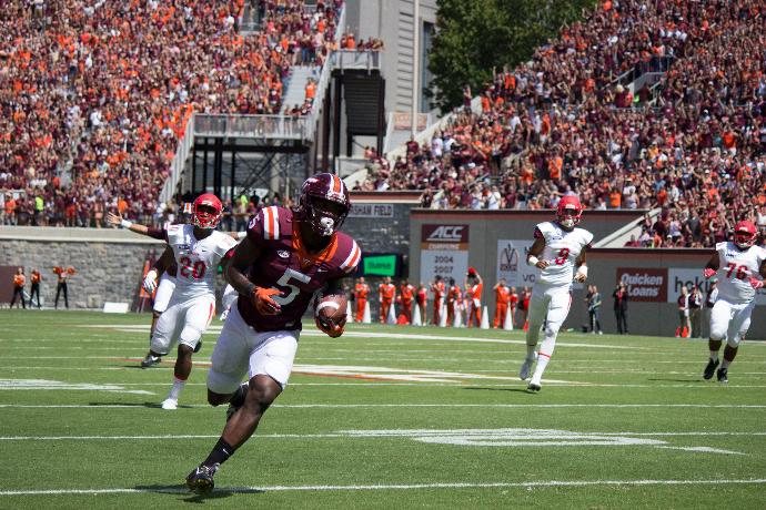 Virginia Tech wide receiver Cam Phillips runs in for a 23-yard touchdown against Liberty University