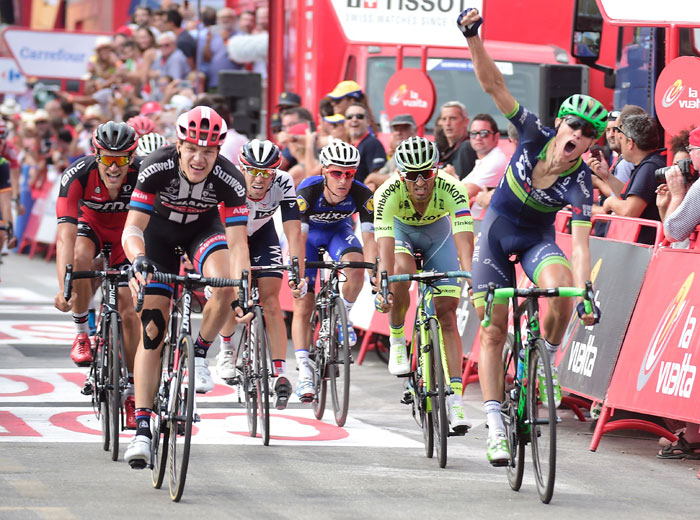 Orica Bikeexchange's Norwegian cyclist Magnus Cort Nielsen celebrates winning as he crosses the finish line during the 18th stage of the 71st edition